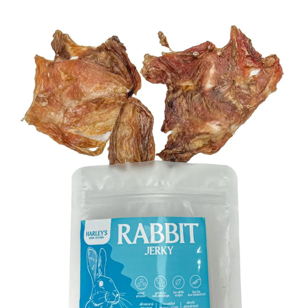 A package of Harley's Rabbit Jerky is displayed with a few pieces of the product laying in front of it. Harley's Rabbit Jerky are 100% natural Pet Treats. These product are now available at Pet Friendly’s online pet supply store.